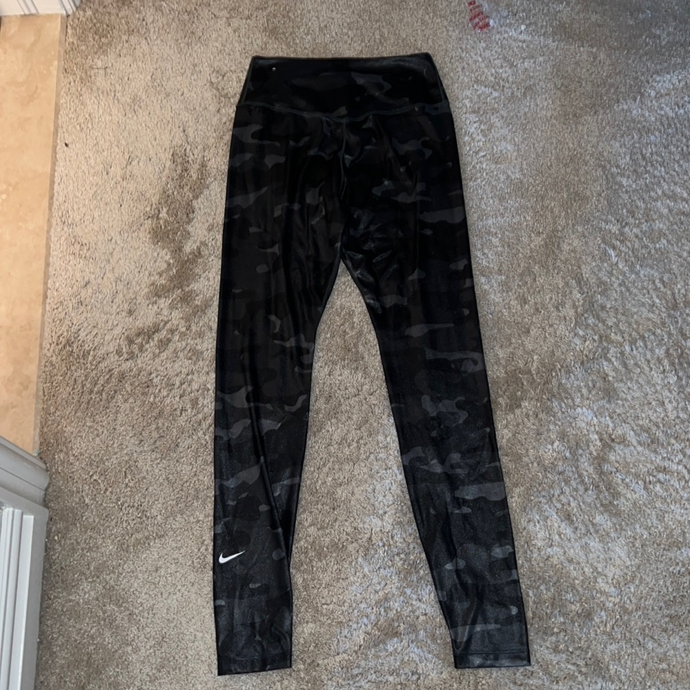 I’m selling holographic black camo leggings from Nike